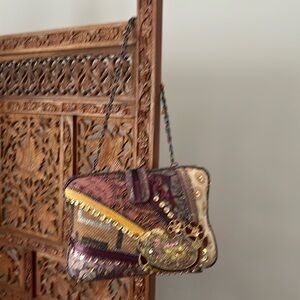 Tapestry, sequins and beaded bag.